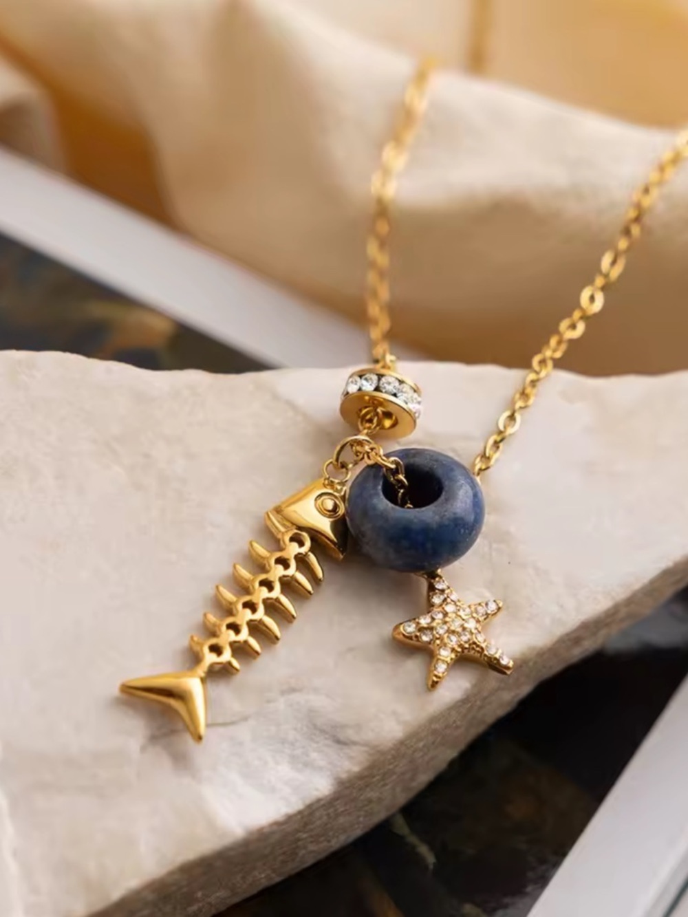 Coastal Dream Gold Fishbone Navy Stone & Star Charm Necklace - Picture 5 of 7